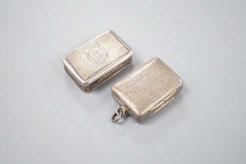 A William IV engraved silver rectangular vinaigrette, with interwoven decoration, TS, Birmingham, 1831, 32mm and a later silver vinaigrette, Birmingham, 1863.